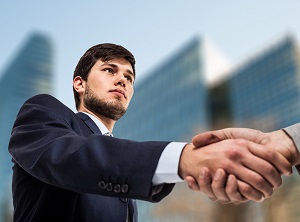 Businessman giving an handshake